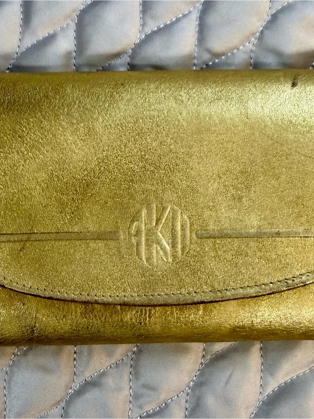 Metallic Gold Phone Wallet Case with Embossed Monogram Detail